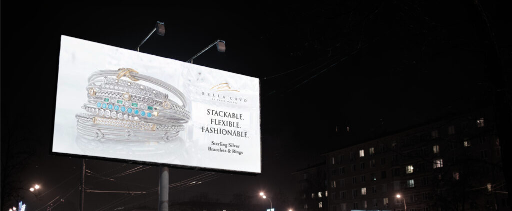 Billboard advertising stackable sterling silver bracelets and rings, read ‘Stackable. Flexible. Fashionable.’ by Bella Cavo.